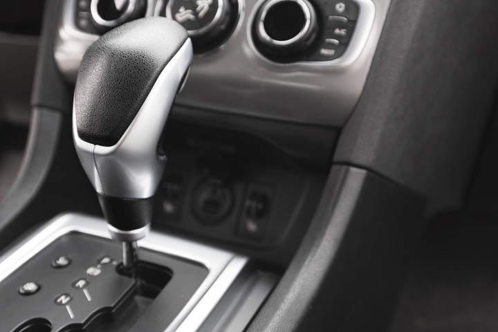 Detail of an automatic gear shifter in a new, modern car. Modern car interior.